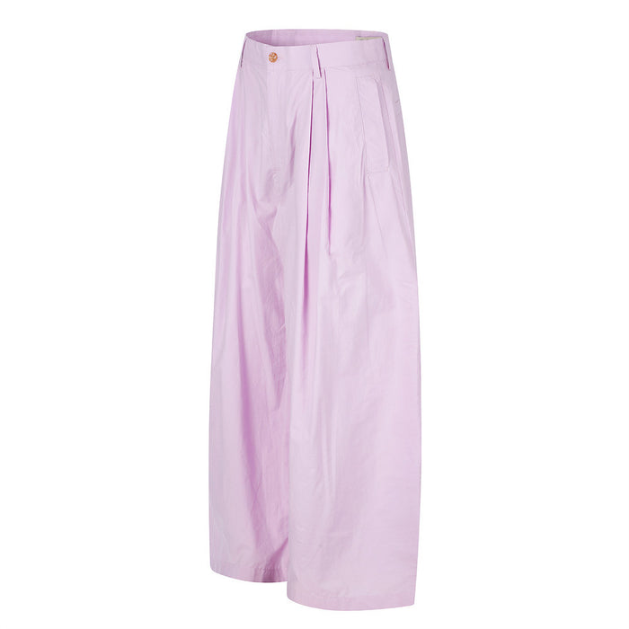 Light pink wide-leg pleated trousers shown in front side view