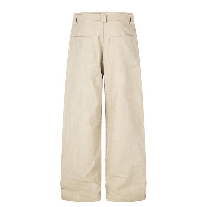 Back view of beige wide-leg trousers with patch pockets and cuffed hems