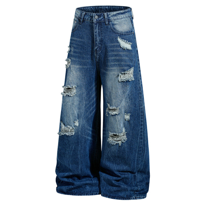Front view of wide-leg blue distressed jeans with frayed rips and faded washed denim
