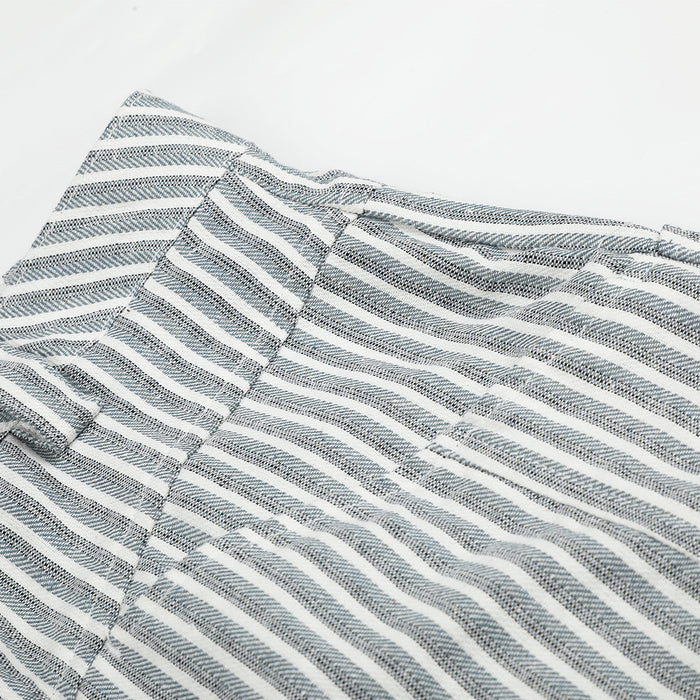Close-up of gray striped pants waistband and upper hip seam detail