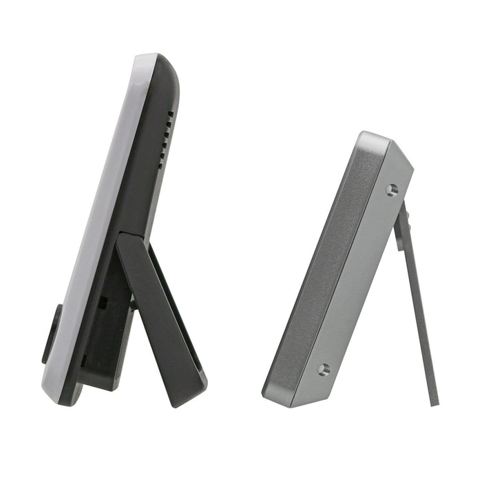 Side view of wireless weather station receiver with a foldable stand in black and gray.